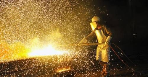 Is a worker beating metal in a foundry an artist