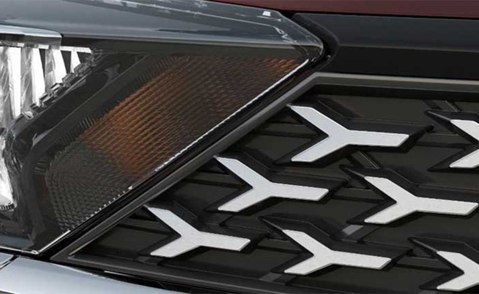 Tata Tigor image chrome finish tri arrow motif on grille