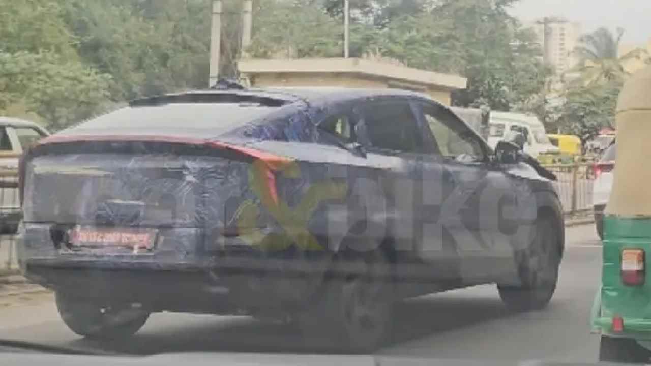 Mahindra XUV.e9 SUV Spied Testing Again Ahead of India Launch, Shows Integrated Roof Spoiler and More